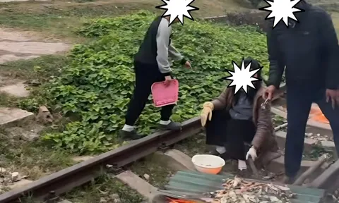 Nướng đồ ăn trên đường ray tàu hỏa, cặp vợ chồng ở Quảng Ninh bị xử phạt