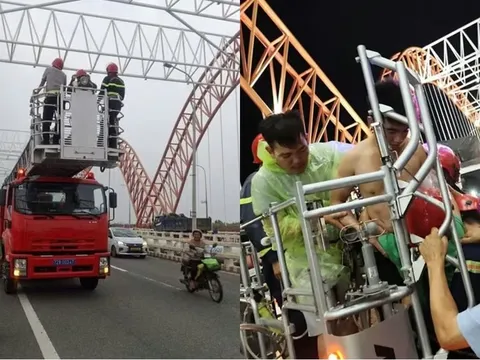 Thanh niên ‘ngáo đá’ leo lên mái vòm cầu Cỏ May rồi cố thủ, công an phải mang xe thang, đệm hơi đến giải cứu